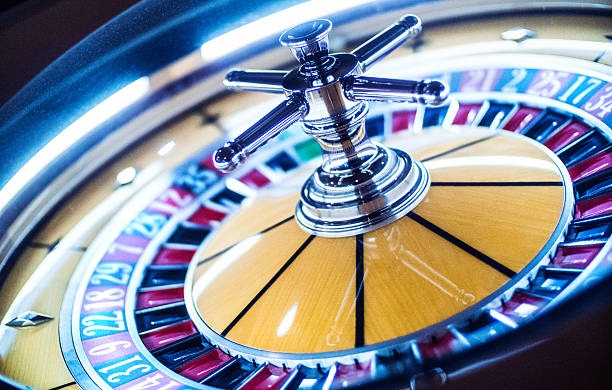 Live dealer studio showing numbered ball draw mechanism for Colok Macau
